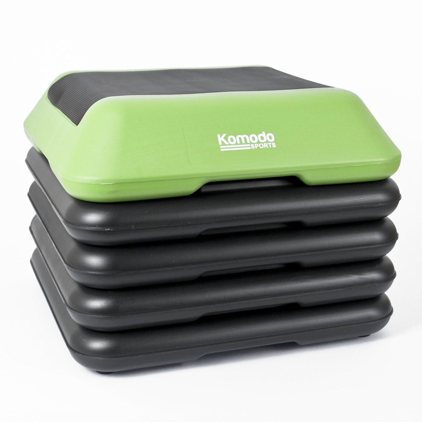 A green & black Komodo Sports 5 Level Aerobic Stepper step for aerobic exercise 