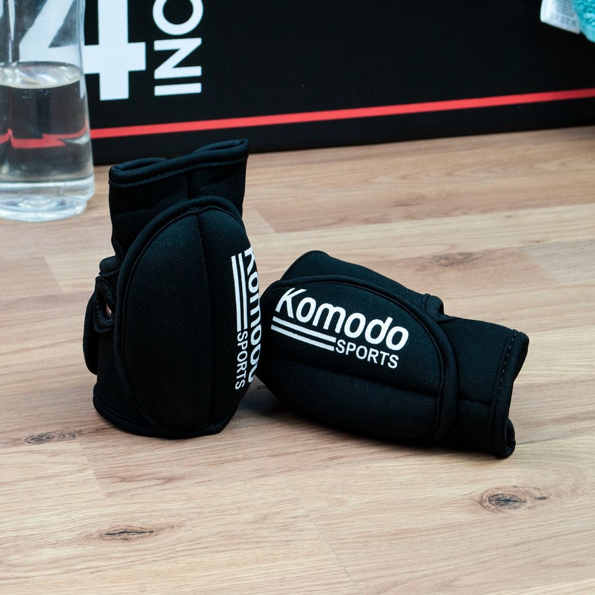 pair of black Komodo Sport Weighted Gloves used for adding weight to your exercise