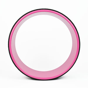 A pink Komodo Sports Yoga Wheel