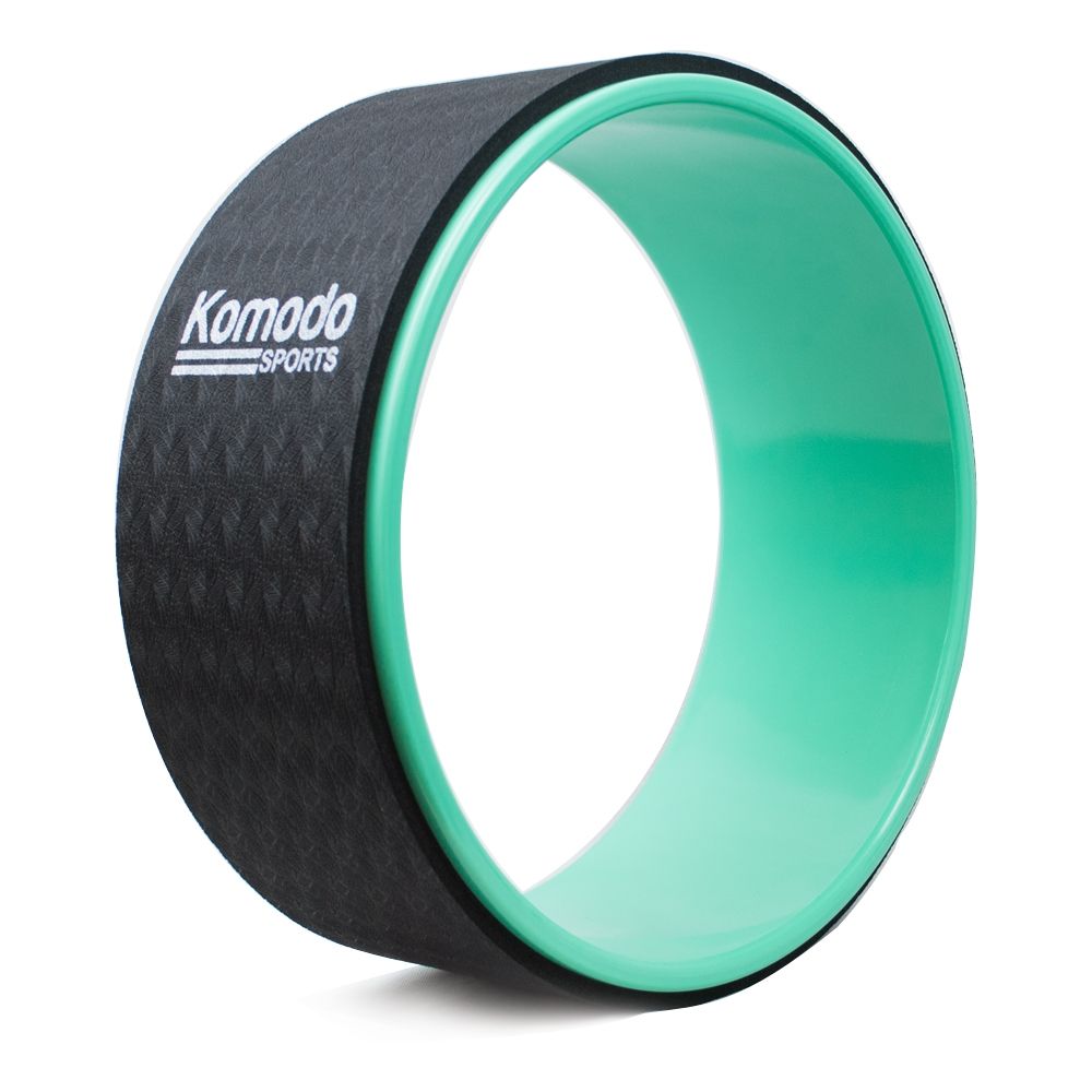 A green  Komodo Sports Yoga Wheel